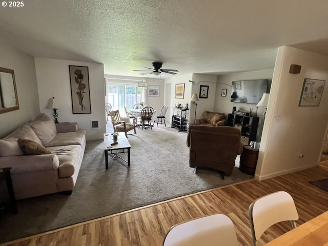 815 Nyssa St, Junction City, OR 97448 - living area with a textured ceiling, wood finished floors, and ceiling fan