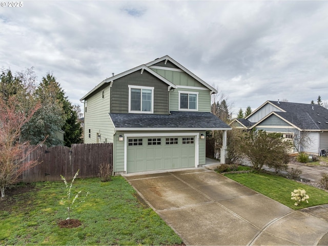 view of front of property with a front yard, concrete driveway, fence, and an attached garage