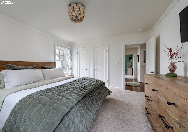 carpeted bedroom with crown molding