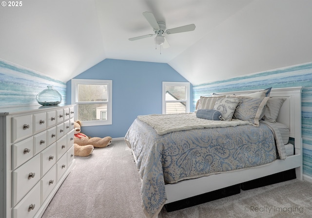 bedroom featuring lofted ceiling, light colored carpet, and ceiling fan