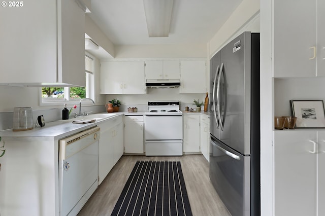 1520 SE 109th Ave, Portland, OR 97216 - kitchen with white appliances, a sink, under cabinet range hood, light countertops, and white cabinets