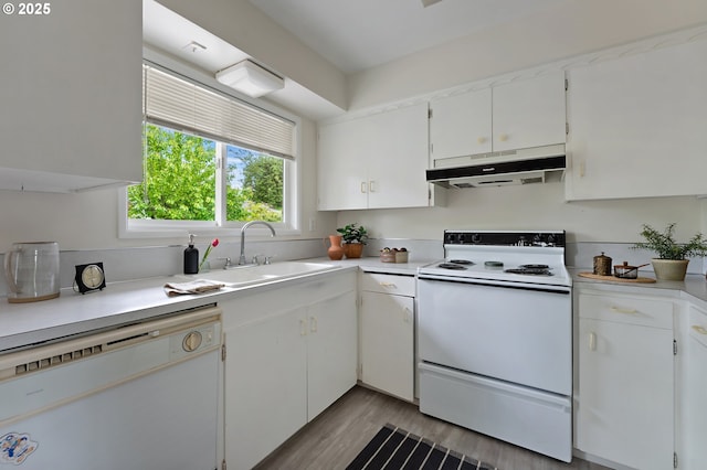 1520 SE 109th Ave, Portland, OR 97216 - kitchen with under cabinet range hood, white appliances, a sink, light countertops, and white cabinetry