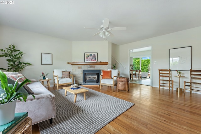 1520 SE 109th Ave, Portland, OR 97216 - living room with wood finished floors, ceiling fan, a glass covered fireplace, and baseboards