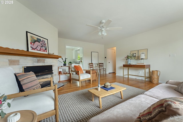 1520 SE 109th Ave, Portland, OR 97216 - living room featuring a ceiling fan, wood finished floors, and a stone fireplace