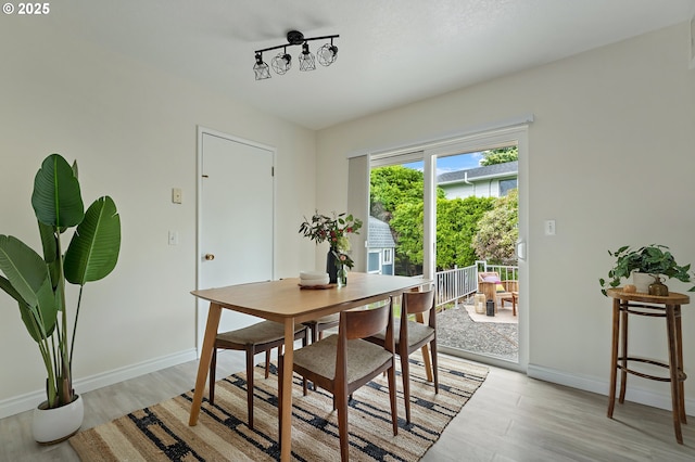 1520 SE 109th Ave, Portland, OR 97216 - dining space with light wood-style flooring and baseboards