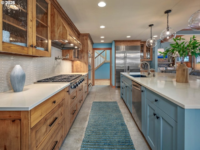 13615 NW Mason Hill Rd, North Plains, OR 97133 - kitchen featuring appliances with stainless steel finishes, a sink, tasteful backsplash, recessed lighting, and glass insert cabinets