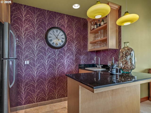 13615 NW Mason Hill Rd, North Plains, OR 97133 - indoor wet bar featuring wallpapered walls, freestanding refrigerator, baseboards, an accent wall, and hanging light fixtures