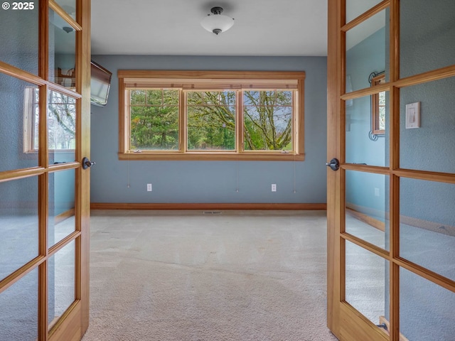 13615 NW Mason Hill Rd, North Plains, OR 97133 - unfurnished room featuring french doors, carpet flooring, and baseboards