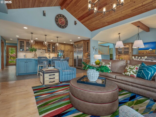 13615 NW Mason Hill Rd, North Plains, OR 97133 - living room with beamed ceiling, light wood finished floors, recessed lighting, and high vaulted ceiling