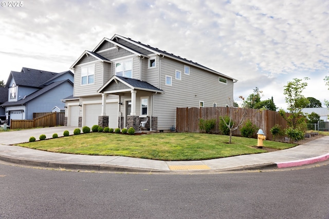 craftsman-style home featuring a garage and driveway