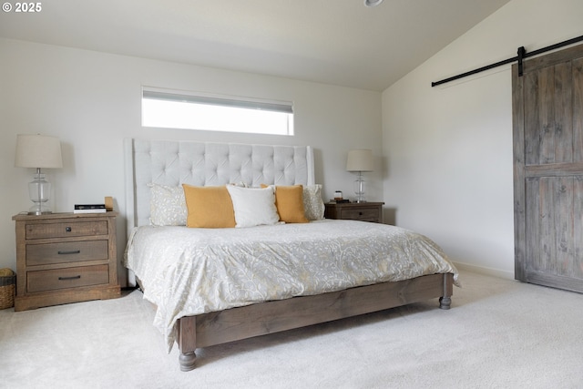 carpeted bedroom with a barn door, lofted ceiling, and baseboards