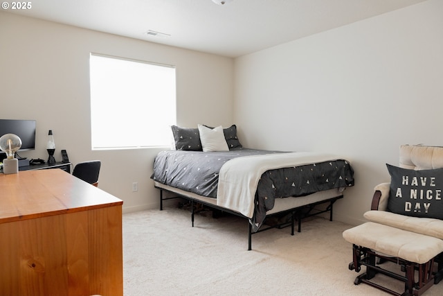 bedroom with carpet and baseboards