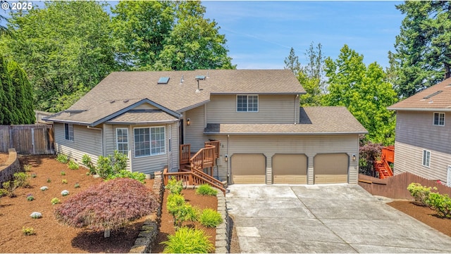 1111 SW Linneman Ave, Gresham, OR 97080 - view of front of house featuring concrete driveway, a shingled roof, stairs, and a garage