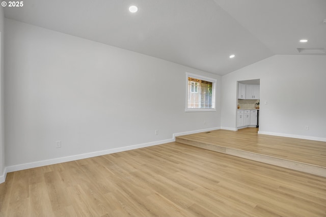 1111 SW Linneman Ave, Gresham, OR 97080 - unfurnished living room featuring lofted ceiling, light wood-style flooring, and recessed lighting