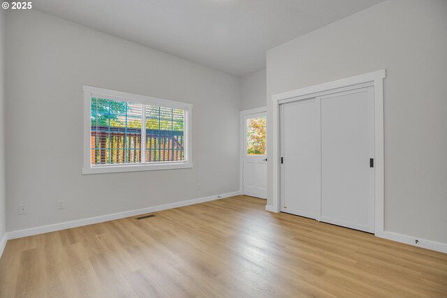 1111 SW Linneman Ave, Gresham, OR 97080 - unfurnished bedroom featuring light wood-style flooring
