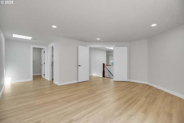 1111 SW Linneman Ave, Gresham, OR 97080 - empty room featuring recessed lighting, light wood-style floors, and a skylight