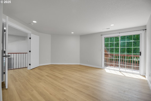 1111 SW Linneman Ave, Gresham, OR 97080 - empty room with light wood finished floors, recessed lighting, and a textured ceiling
