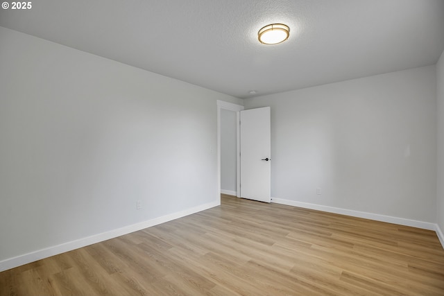 1111 SW Linneman Ave, Gresham, OR 97080 - spare room with light wood-style floors and a textured ceiling