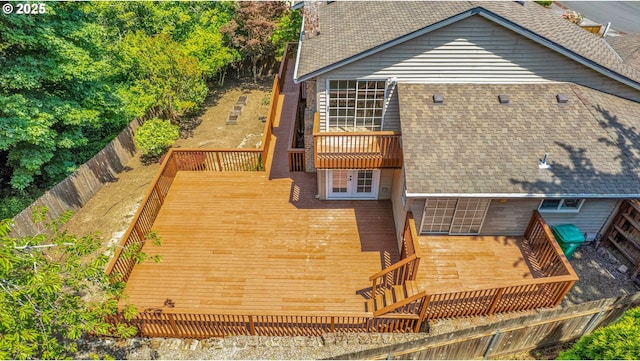 1111 SW Linneman Ave, Gresham, OR 97080 - rear view of house featuring french doors, a wooden deck, a shingled roof, and a fenced backyard
