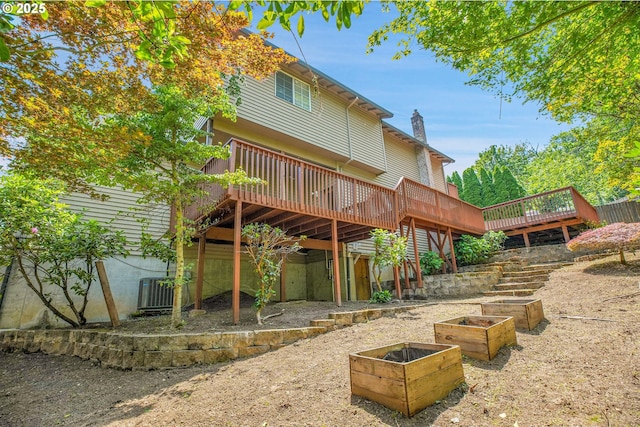 1111 SW Linneman Ave, Gresham, OR 97080 - back of house with a wooden deck, a chimney, and a garden