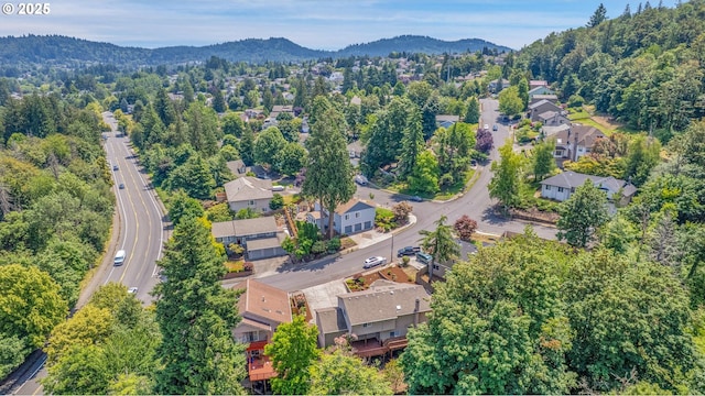1111 SW Linneman Ave, Gresham, OR 97080 - aerial overview of property's location featuring a mountain backdrop and nearby suburban area
