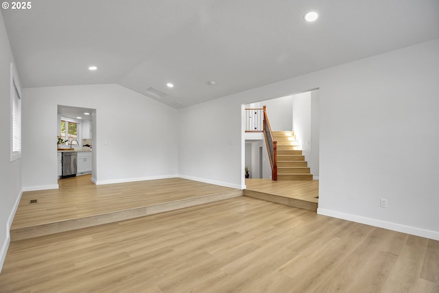 1111 SW Linneman Ave, Gresham, OR 97080 - unfurnished living room featuring stairway, lofted ceiling, light wood-style floors, and recessed lighting