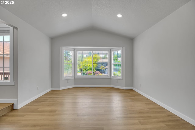 1111 SW Linneman Ave, Gresham, OR 97080 - unfurnished room with lofted ceiling, a textured ceiling, light wood-style flooring, and recessed lighting
