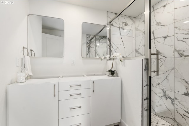 bathroom with vanity and an enclosed shower