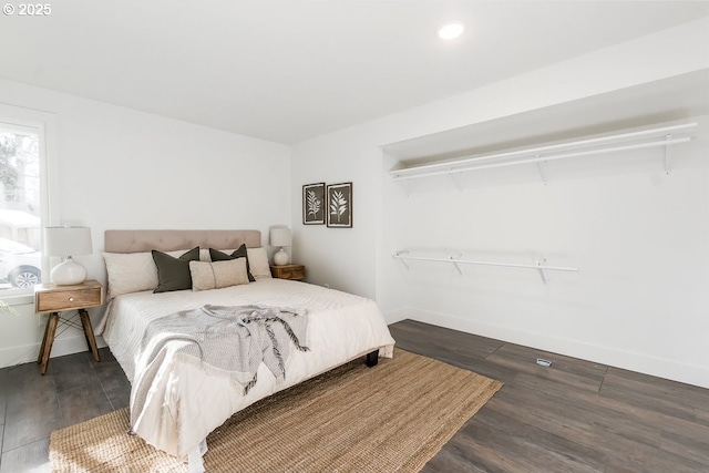 bedroom featuring dark wood-type flooring