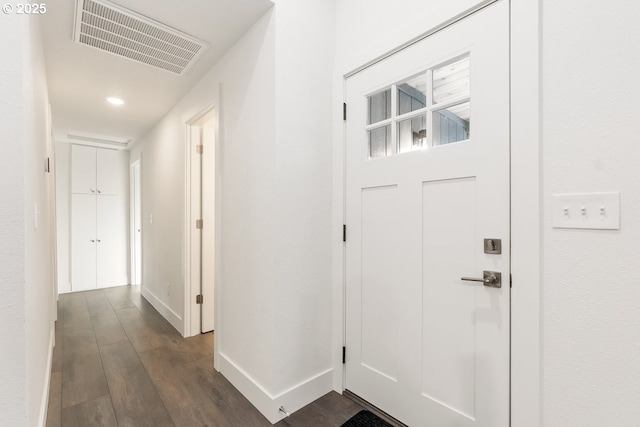 entryway with dark hardwood / wood-style floors