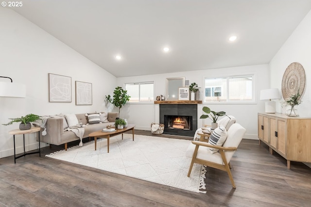 living room with hardwood / wood-style flooring and vaulted ceiling