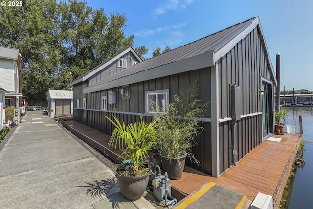 11868 N Jantzen Dr, Portland, OR 97217 - view of home's exterior featuring board and batten siding and a water view