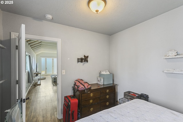 11868 N Jantzen Dr, Portland, OR 97217 - bedroom featuring wood finished floors and a textured ceiling