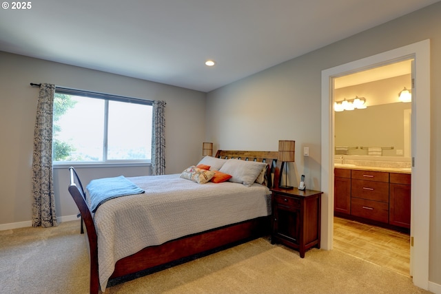 1637 E 21st St, The Dalles, OR 97058 - bedroom featuring light carpet, ensuite bathroom, recessed lighting, a sink, and baseboards