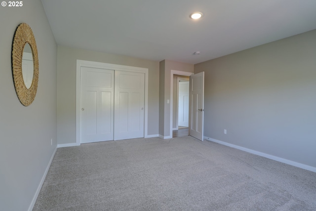 1637 E 21st St, The Dalles, OR 97058 - unfurnished bedroom with baseboards, light colored carpet, a closet, and recessed lighting
