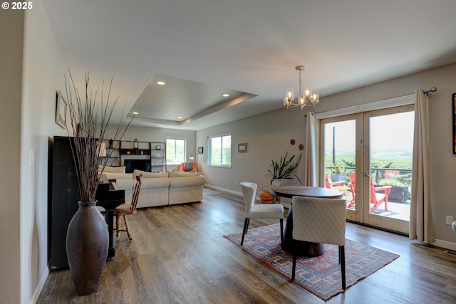 1637 E 21st St, The Dalles, OR 97058 - dining space with baseboards, french doors, wood finished floors, recessed lighting, and a fireplace