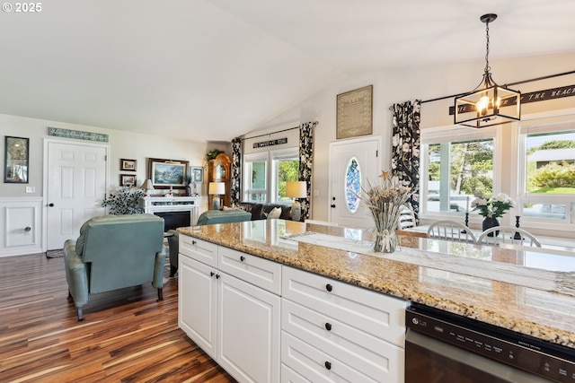 kitchen featuring dishwasher, a chandelier, lofted ceiling, dark wood-style floors, and white cabinets