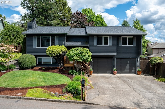 11782 SE 108th Ave, Happy Valley, OR 97086 - bi-level home with concrete driveway, an attached garage, a chimney, and a shingled roof
