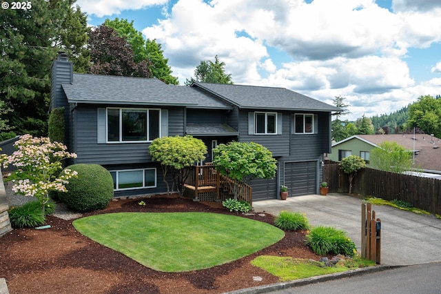11782 SE 108th Ave, Happy Valley, OR 97086 - split foyer home with driveway, a chimney, roof with shingles, and a garage