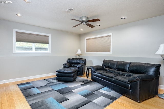 11782 SE 108th Ave, Happy Valley, OR 97086 - living area featuring wood finished floors, a ceiling fan, and recessed lighting