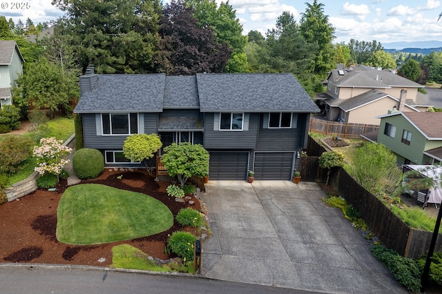 11782 SE 108th Ave, Happy Valley, OR 97086 - view of front of property featuring driveway, a shingled roof, a garage, a chimney, and a residential view