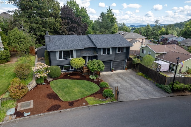 11782 SE 108th Ave, Happy Valley, OR 97086 - view of front of house with a chimney, concrete driveway, a shingled roof, and a garage