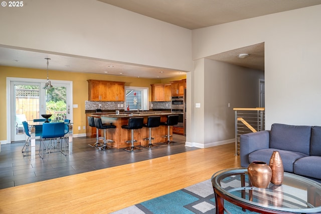 11782 SE 108th Ave, Happy Valley, OR 97086 - living area featuring dark wood-style flooring and stairs