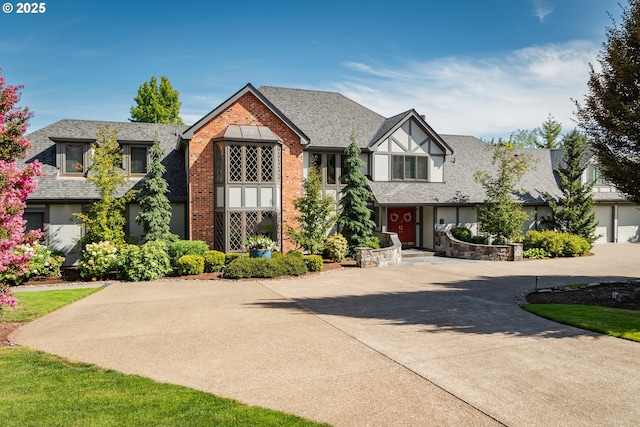 14210 SW 150th Ave, Tigard, OR 97224 - english style home with curved driveway, brick siding, stucco siding, and roof with shingles