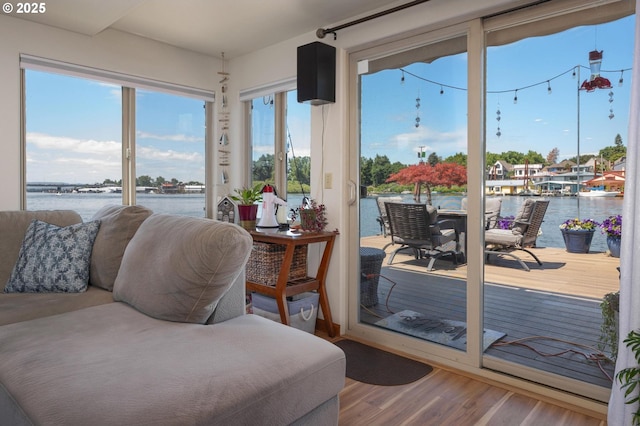 429 N Bridgeton Rd # 15, Portland, OR 97217 - sunroom featuring a water view and wood finished floors