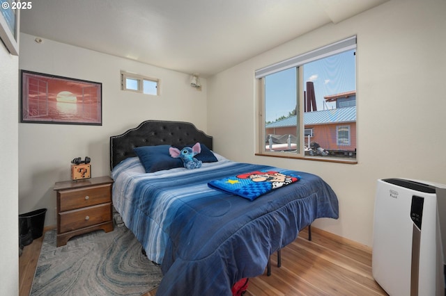429 N Bridgeton Rd # 15, Portland, OR 97217 - bedroom featuring wood finished floors and baseboards