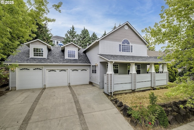 view of front facade with a garage, covered porch, roof with shingles, and concrete driveway