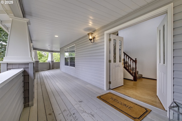 wooden terrace with a porch