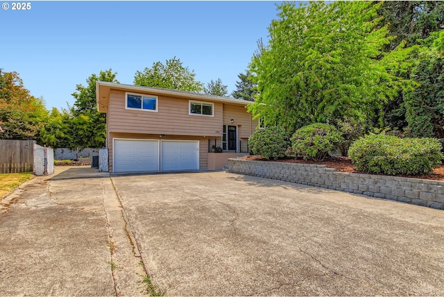 4080 SW 196th Ave, Beaverton, OR 97078 - raised ranch featuring concrete driveway and an attached garage
