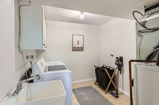 4080 SW 196th Ave, Beaverton, OR 97078 - laundry area featuring water heater, cabinet space, separate washer and dryer, and light tile patterned floors